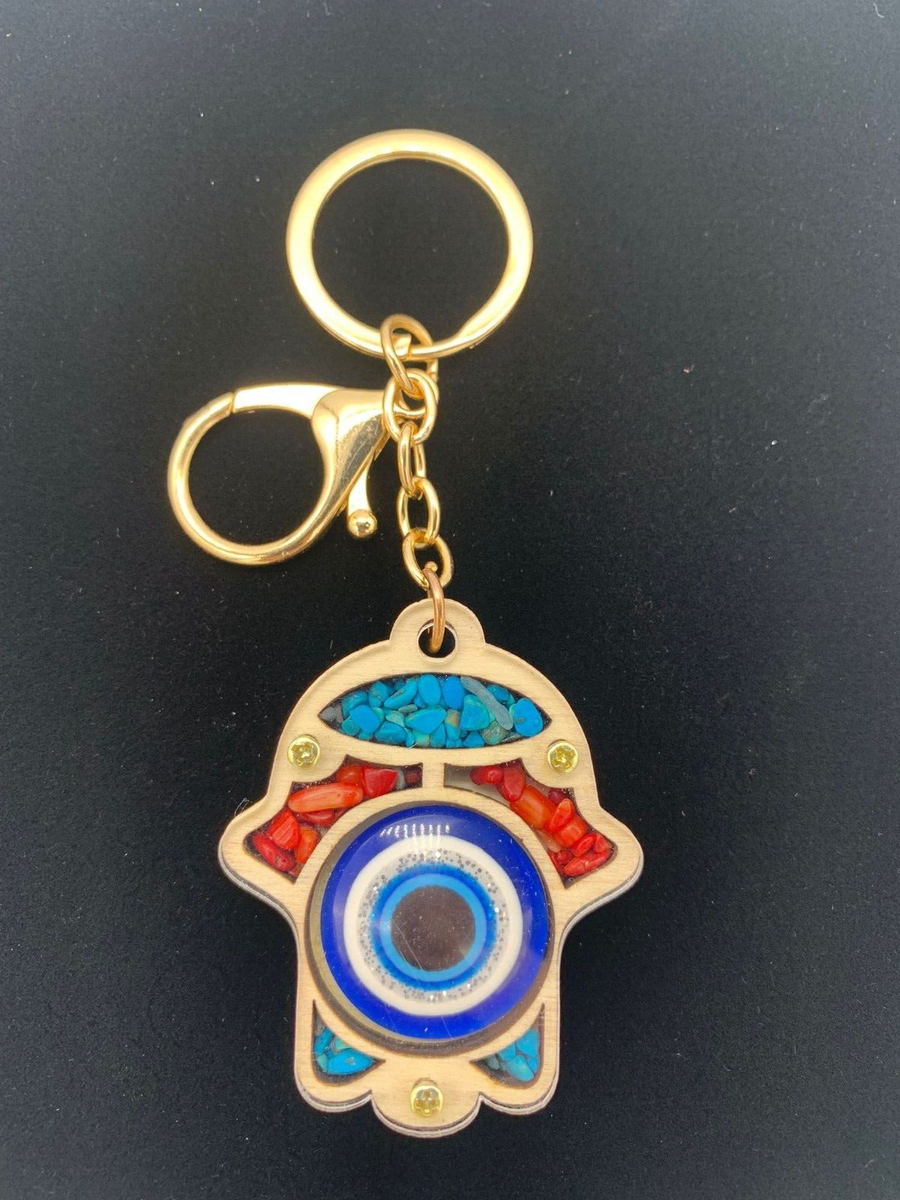 Hamsa hand keychain with blue evil eye protection at the center