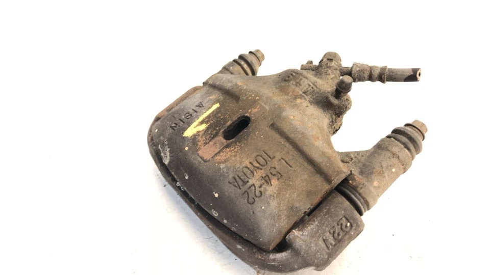 Pinza de freno delantera izquierda Toyota Camry Driver 1986 con soporte de montaje 4775032041 Foto 3 de 4