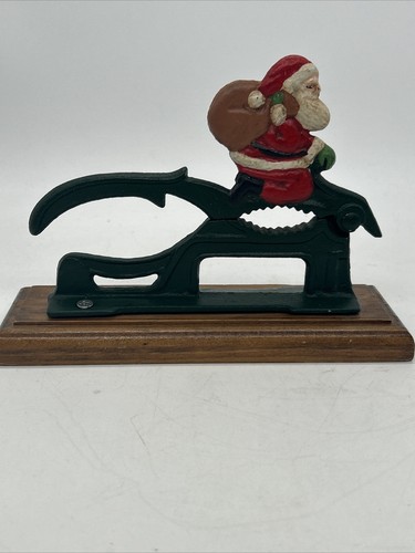 Vintage Black Cast Iron Nutcracker Red wooden base Santa Clause & Toy Bag - 第 1/4 張圖片