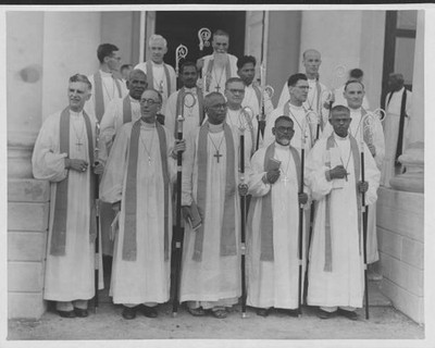 The Reverend CK Jacob stands with fourteen bishops of the South In- Old Photo