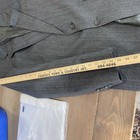 Grey vintage Christian Dior Monsieur suit jacket size 44 with notch lapels, button front, and white sleeve and pant measurements.