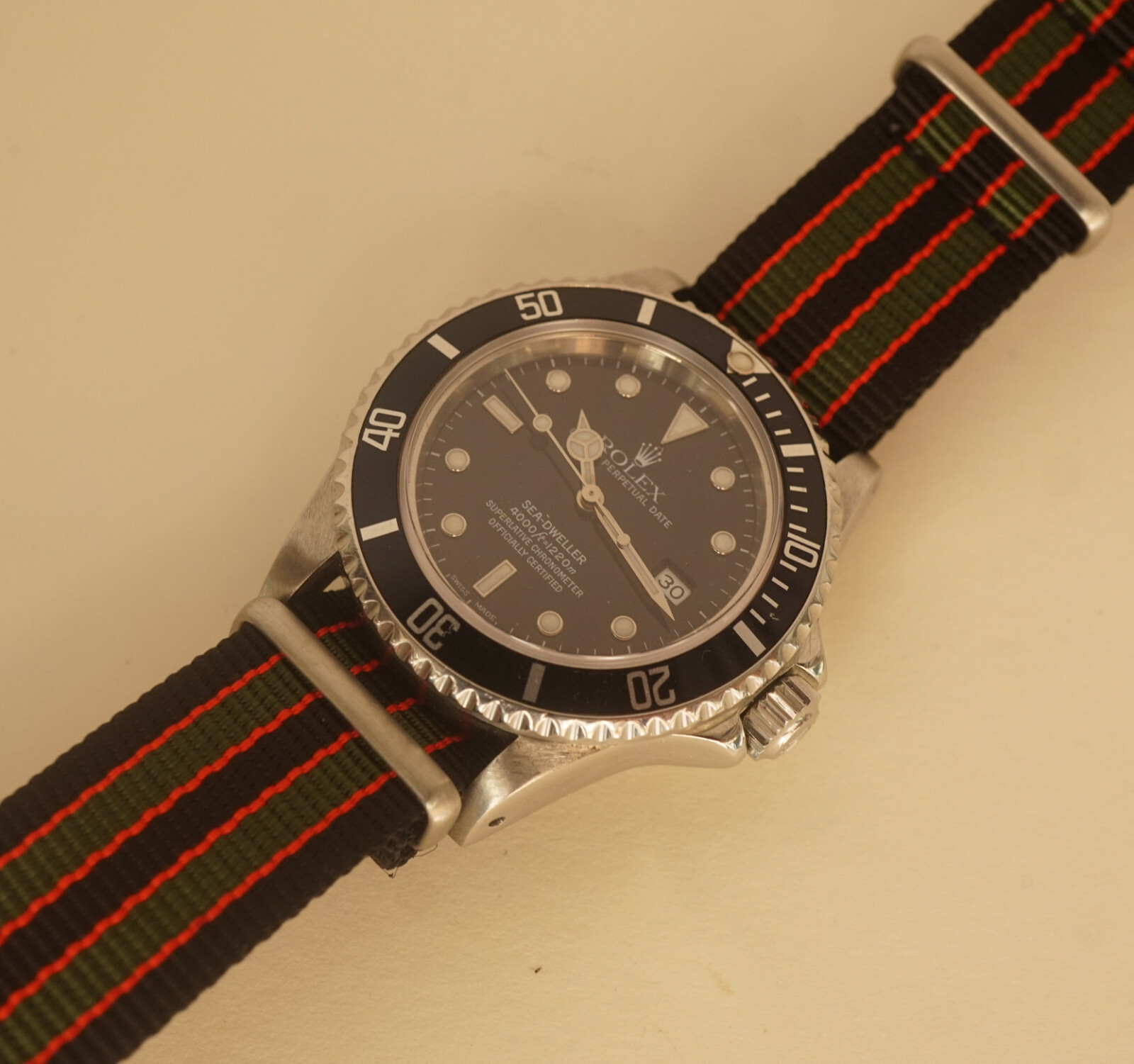 A close-up of the James Bond NATO strap Goldfinger, showcasing its vibrant colors and durable nylon construction.