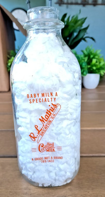R.L. Mathis, Decatur GA - 1 quart milk bottle orange graphics excellent