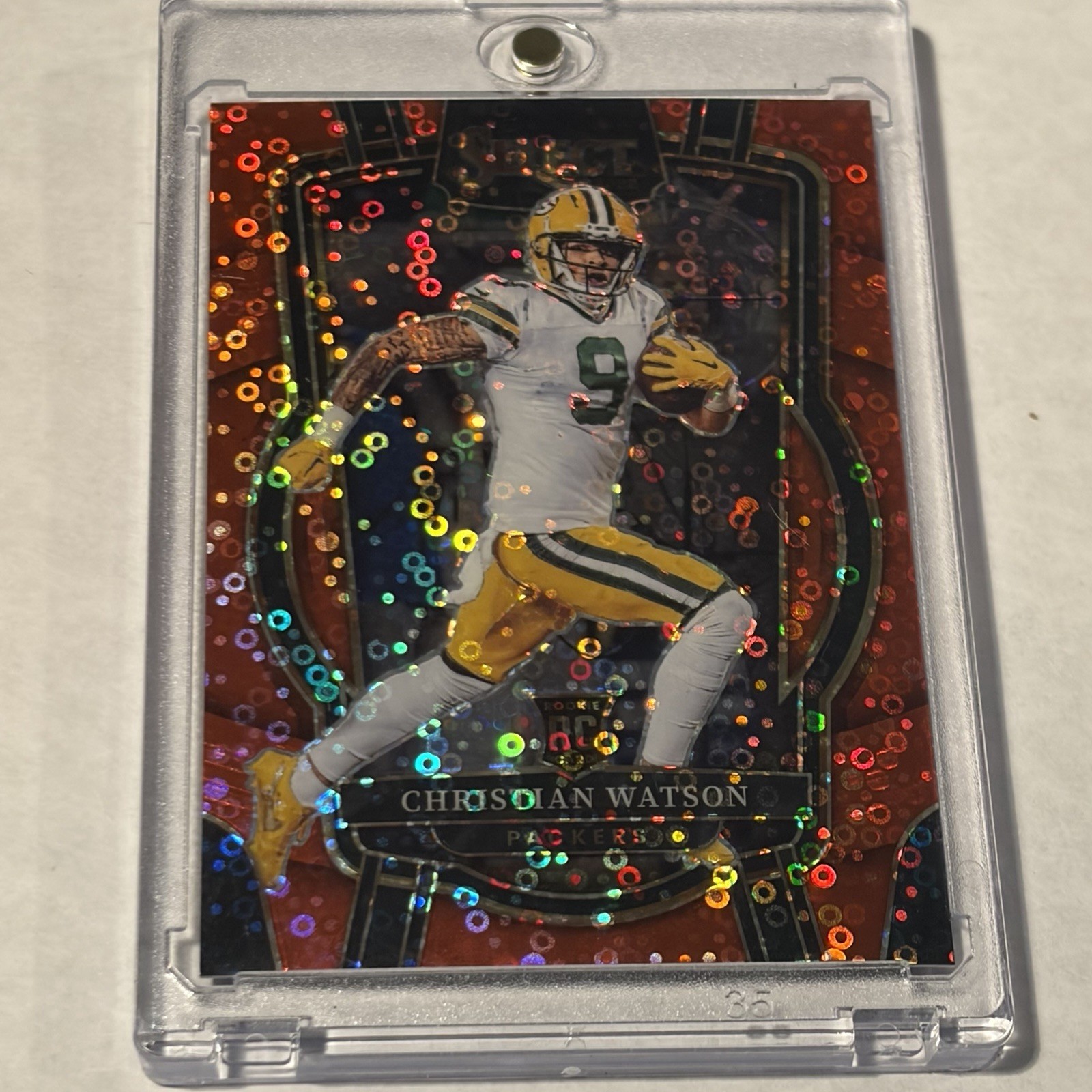 2022 Panini Select - Club Level Christian Watson #265 Red Disco Prizm /49 (RC)