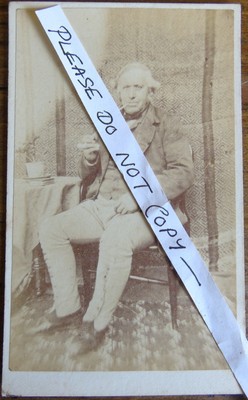Victorian CDV Gentleman With A Very Long Pipe and Wearing Gaiters