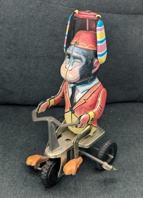 Wind-Up Metal Monkey on Tricycle. With a Spinner on His Head Spins & Moves 7''