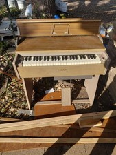 antique yamaha elecyric organ with a desktop