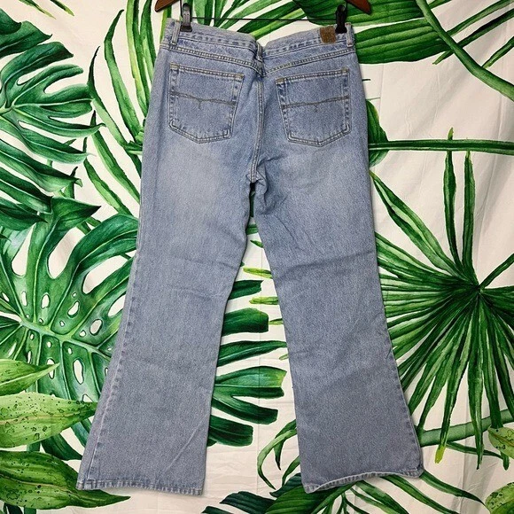 Pantalones de mezclilla acampanados con botones de lavado claro inclinados vintage para jóvenes 11 Foto 2 de 4