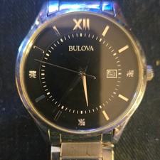 Bulova Classic 96D142 watch features a black dial accented with diamond markers