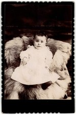Cabinet Card Circa 1890s Cute Baby In Dress On Fur Unmarked