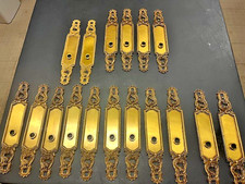 A large set of new gold plated Sherle Wagner door handle backplates