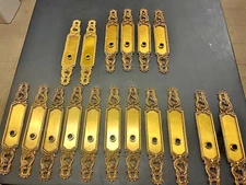 A large set of gold plated Sherle Wagner door handle backplates 