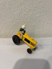 vintage jack in the box restaurant toys, yellow tractor man with green outfit