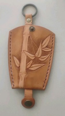 A Handmade Leather Wallet For Keys And Coins With Button Lock