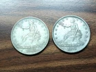 Souvenir Copies Only- Lot of (2) 1873, 1875 United States Trade Dollar.