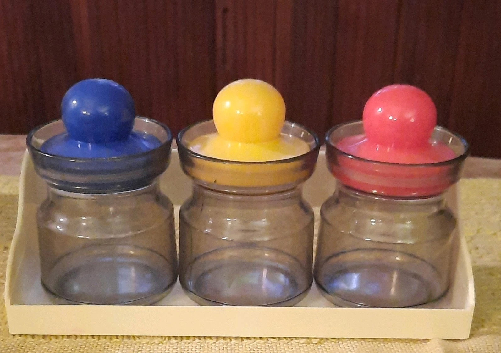 3 Plastic Spice Jar Set with Blue, Yellow, Red Lids & Wall Mounted Rack