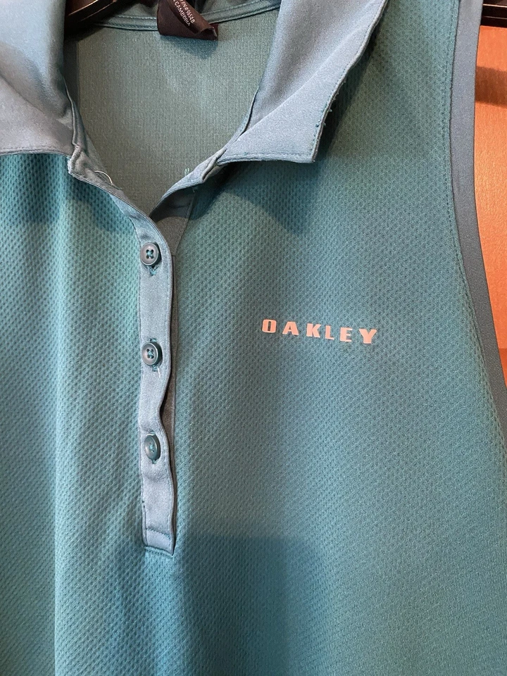 Camisa polo para mujer sin mangas con logotipo Oakley talla mediana golf verde azulado cuello con botones  Foto 2 de 4