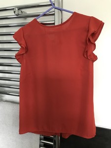 orange chiffon shirt