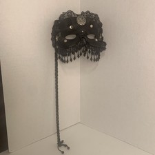 Vintage Mystery Black lace and jeweled Venetian masquerade mask with a handle