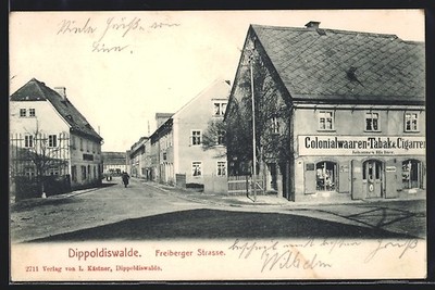 Postcard Dippoldiswalde, Freiberger Strasse with colonial goods shop J. Richter 