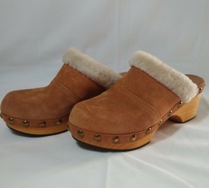 fur lined wooden clogs