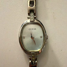 GUESS Women’s Oval Analog Dress Watch Quartz Silver Tone Metal Bracelet