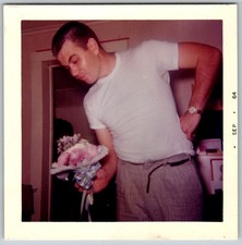 Vtg Color Snapshot Man in White T-Shirt Holding Flower Bouquet Wedding Prep 1964