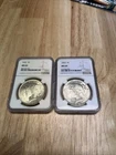 2- MS64 Silver Peace $1s 1922 & 1923