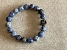 Beaded blue clay and rhinestone bracelet on elastic string to expand