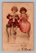 Postcard Christmas Greetings Boy Girl on Bench Eating Ice Cream Signed c1905 M27