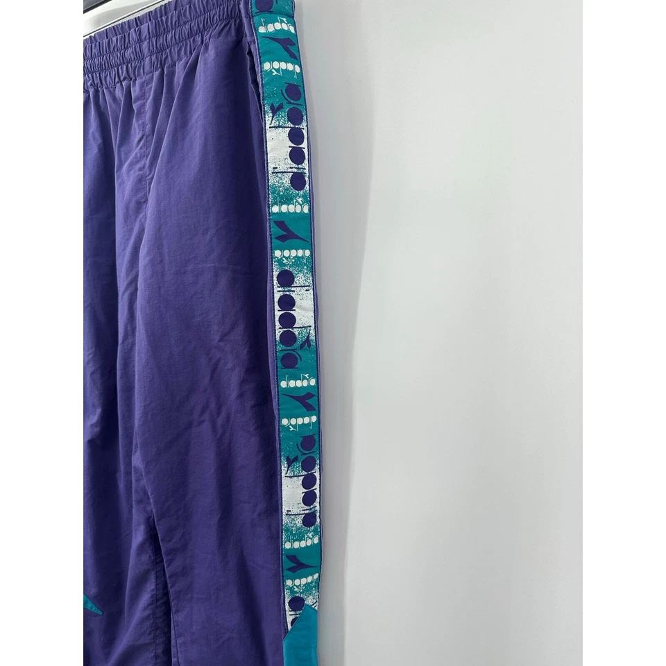 Pantalón de chándal Diadora MVB para hombre púrpura retro forrado de malla al tobillo cremallera talla M Foto 3 de 4