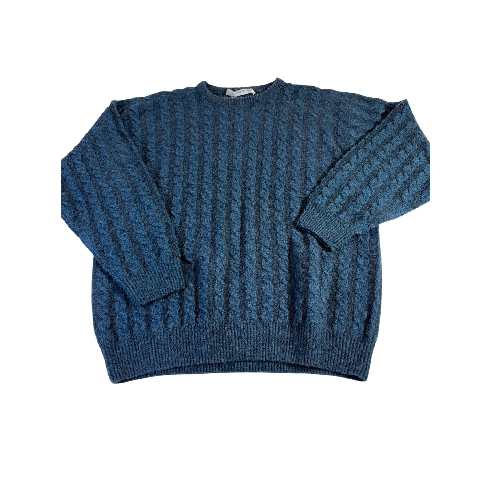 Blue cable-knit wool sweater, flat lay.