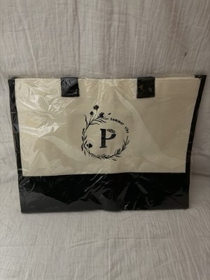 canvas tote bag with a black base, black handles, and a ''summer vibes''