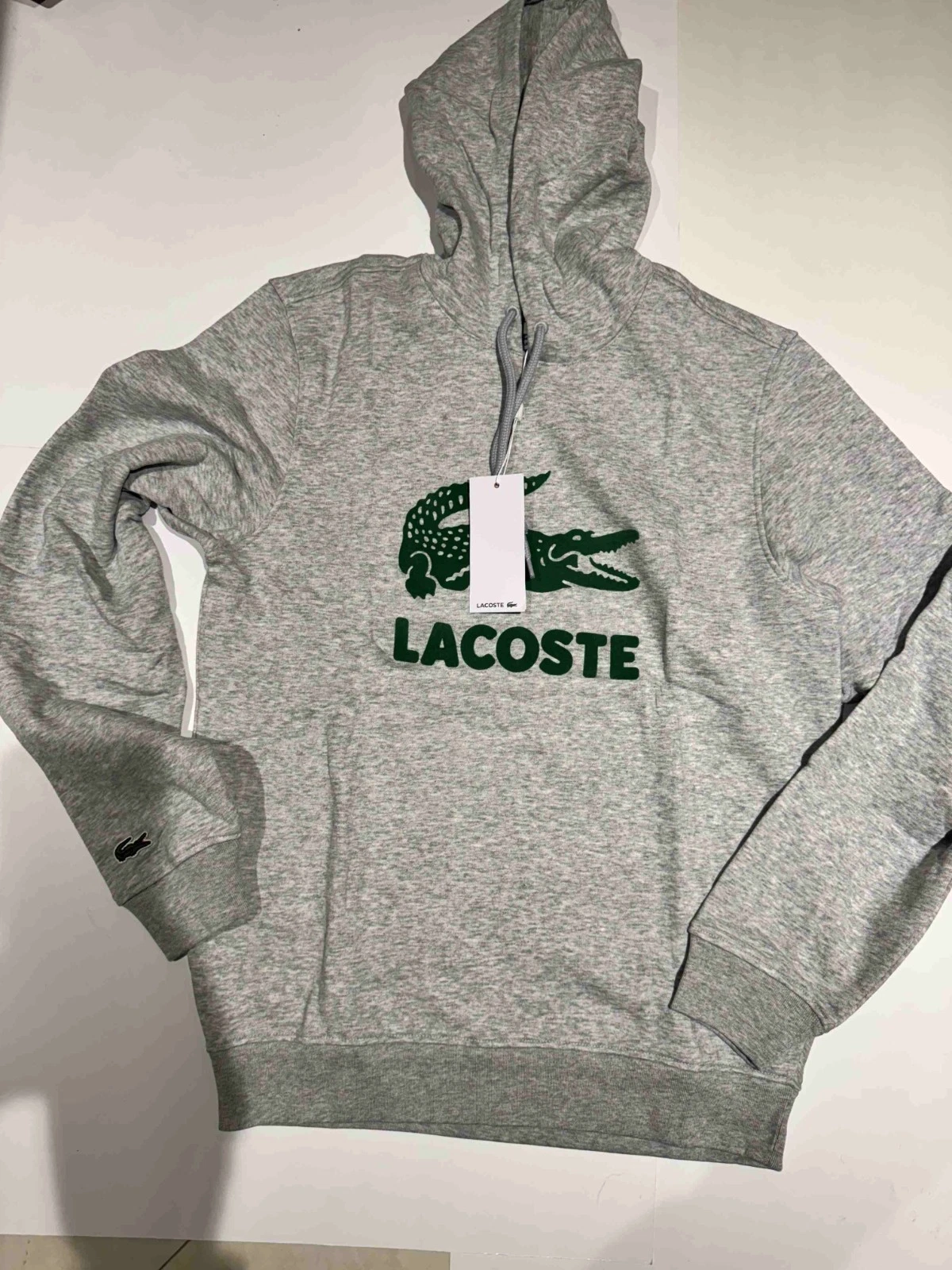 Lacoste Crackled Print Logo Hoodie FLEECE HEATHER GRAY SIZE S ONLY
Opens in a new window or tab