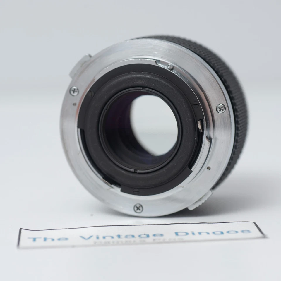 Lente Olympus OM-SYSTEM E.Zuiko Auto-T 100 mm f/2,8 MF con tapas + filtro Foto 4 de 4