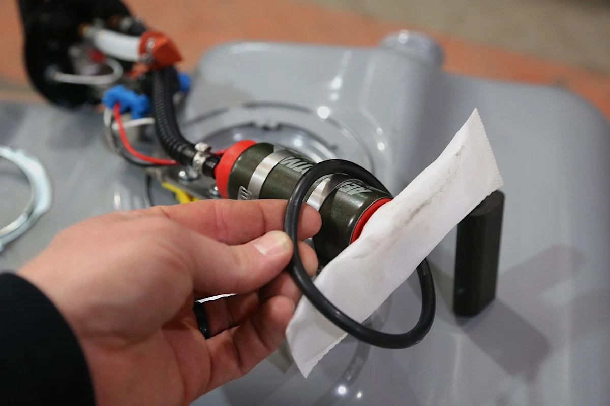 Install a new filter sock and O-ring before reinstalling the pump into the tank.