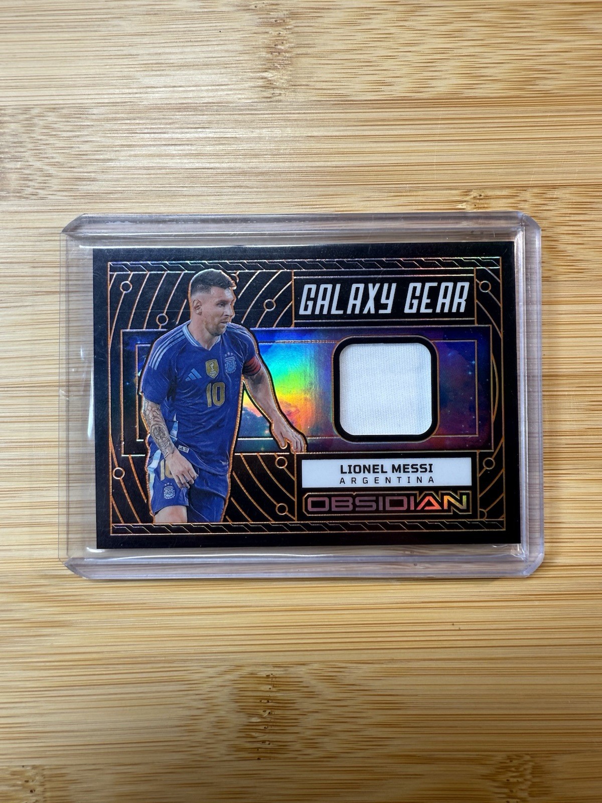 2023-24 Panini Obsidian Lionel Messi #GG-LM Galaxy Gear Patch Jersey Orange /99