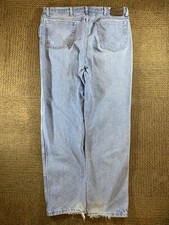 Vintage distressed Wrangler light blue jeans with relax fit
