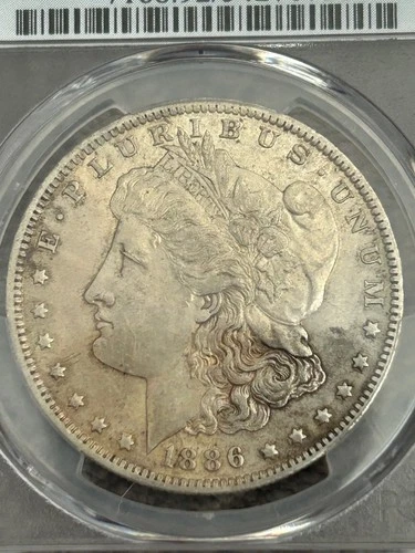 PCGS 1886-O MORGAN SILVER DOLLAR, AU-Details, cleaned. Looks AU-53