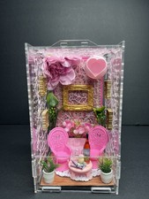 Pink wine room jumping spider enclosure with pink chairs, couch, heart hide