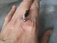 Black Diamond flower pendant, 0.11 carats, in 0.56 grams of 925 Sterling Silver