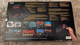 Boxed Atari Jaguar Console with 8 Games, spare controller and instructions.