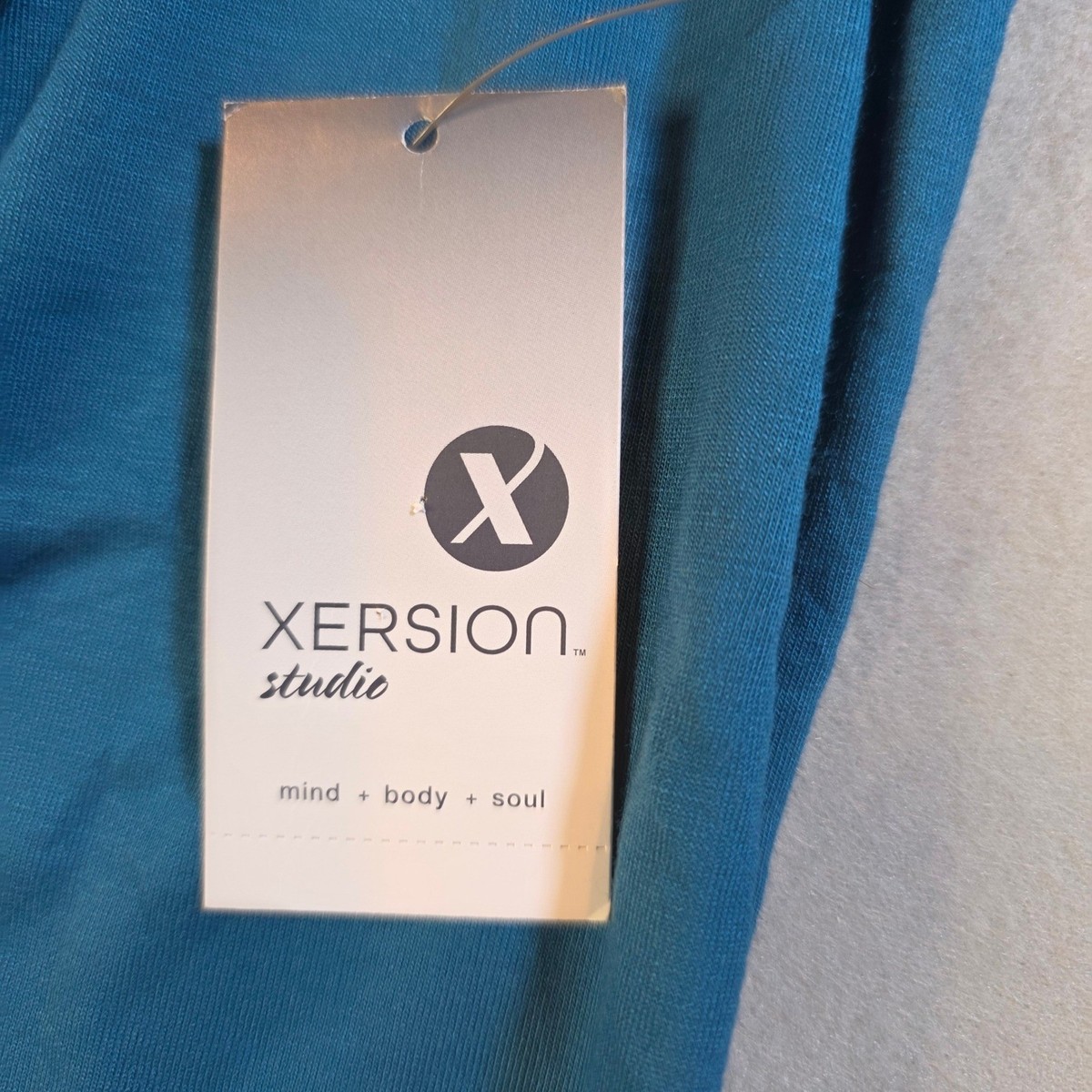 Xersion Studio Corsair Blue Relaxed Fit Long Sleeve Wrap Top Size ST NWT View 4
