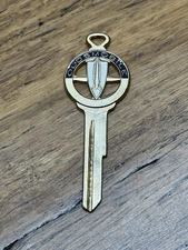 Oldsmobile Shield Bomber Logo Gold Tone & Enamel Vintage Car Key Blank