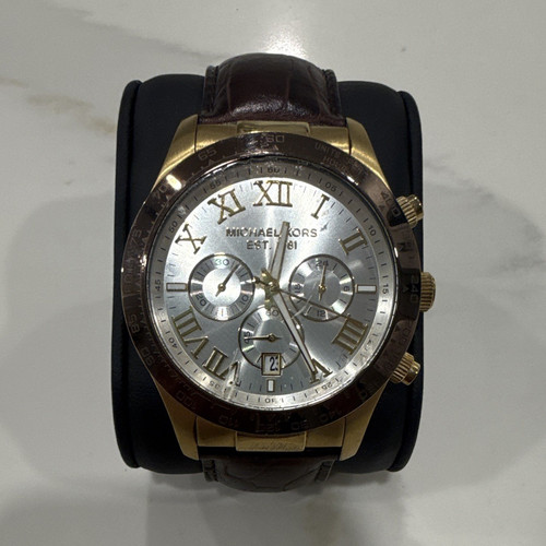 Michael Kors Men’s Analog Wristwatch Silver Dial Roman/Stick Date Brown Leather