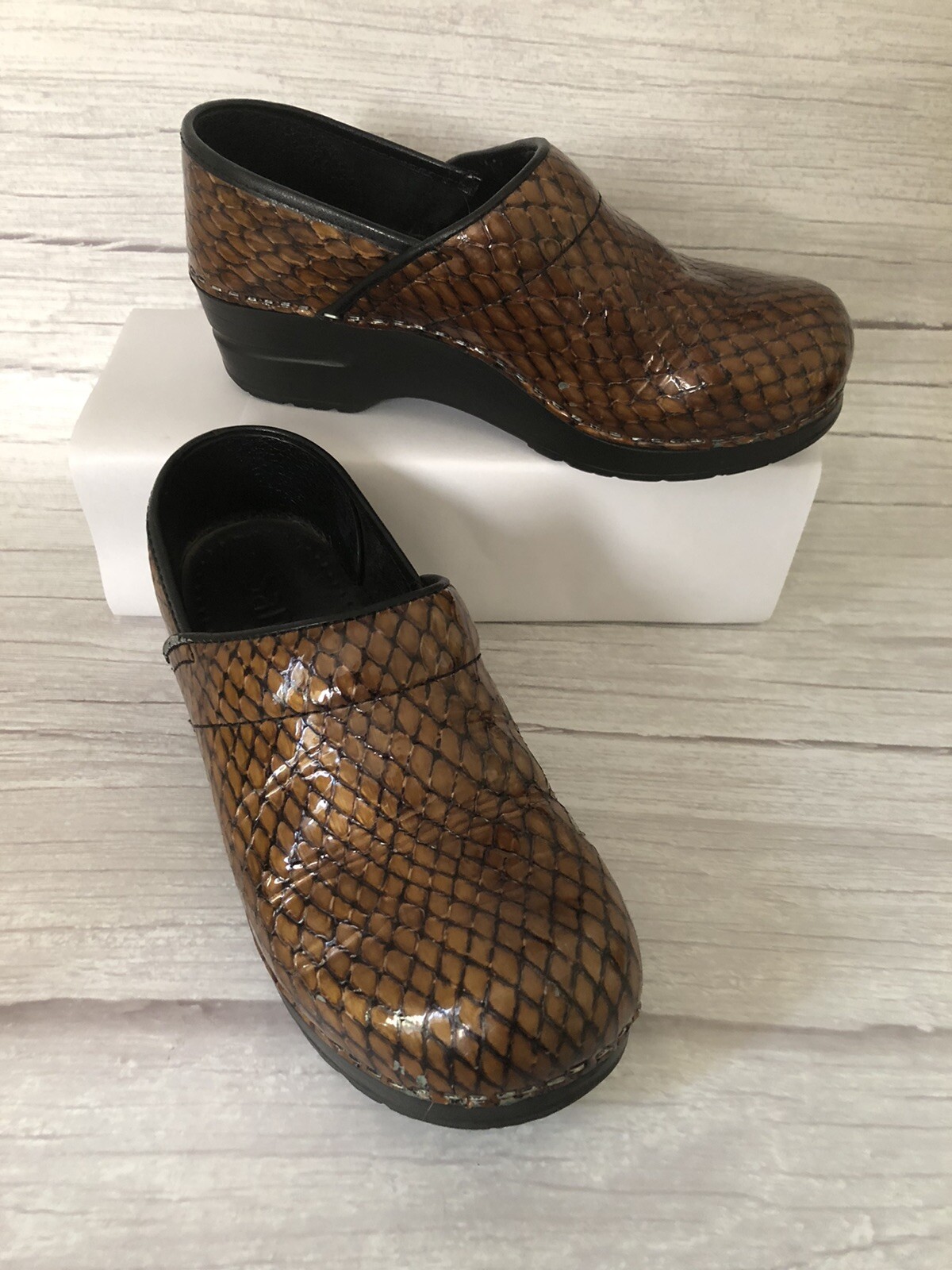 sanita snakeskin clogs