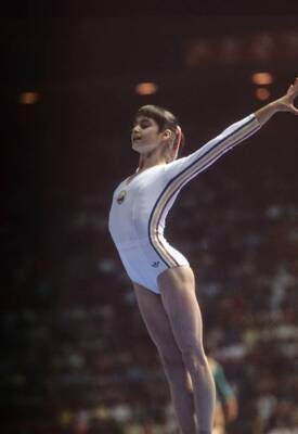 Olympics Romania Nadia Comaneci victorious after landing during Wo- Old Photo