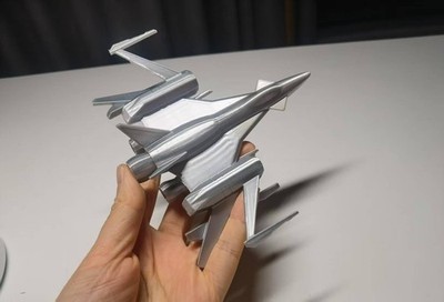 3D printed spacecraft X Flying Leopard Defender fighter jet, made of shiny silve