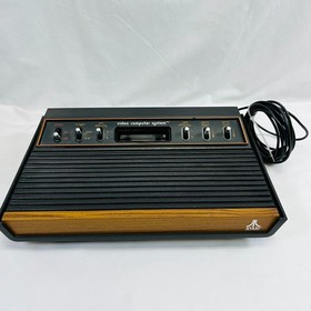 Atari 2600 Console Bundle: Joysticks, Paddles, Atari Force Comic, Organizer, Pin