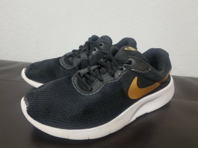 nike tanjun black gold